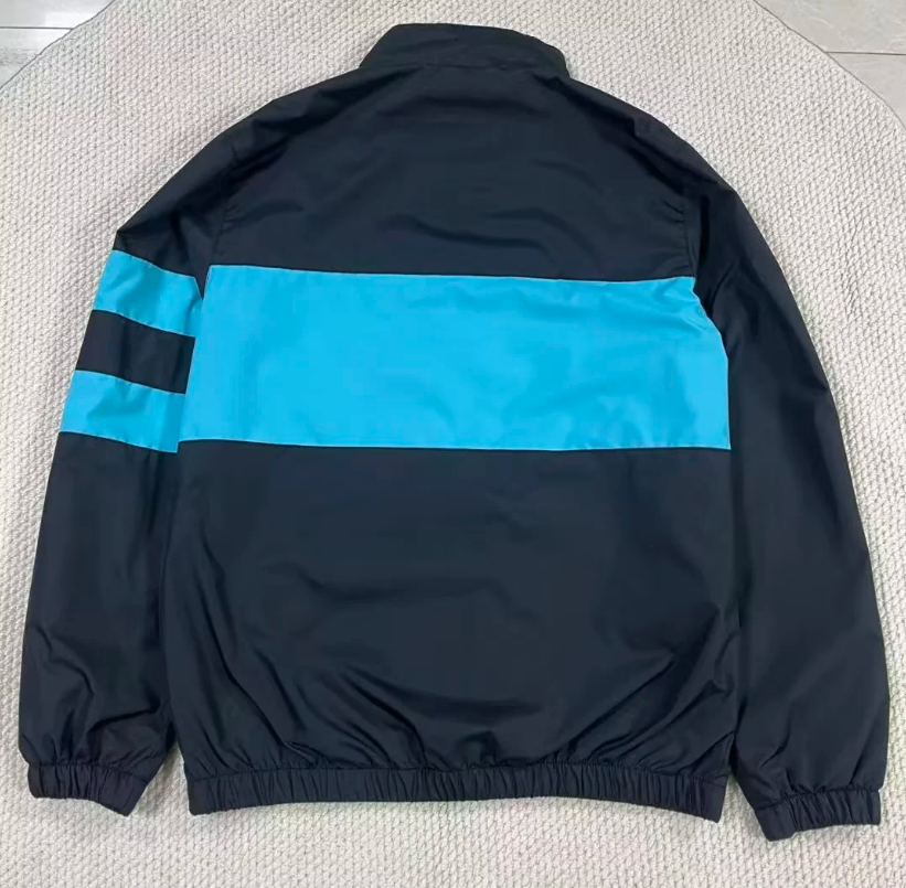Chaqueta cortavientos Barcelona 26-27 negra con azul (tallas S-XXL)