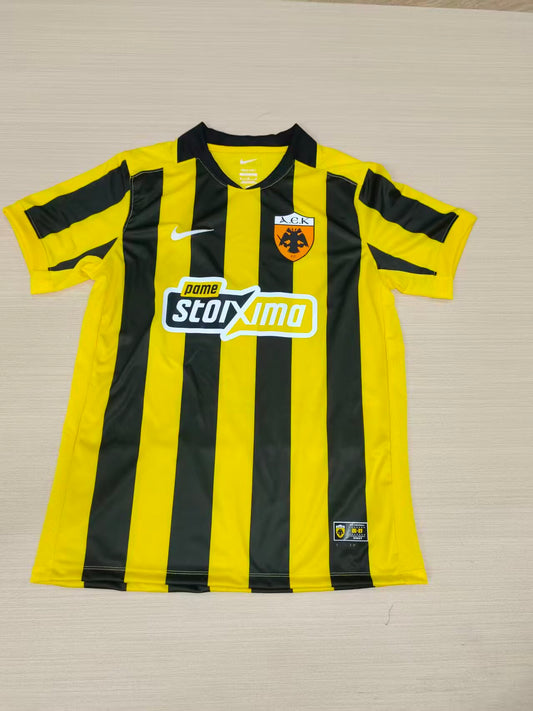 Camiseta Aek 26-27 local (tallas S-4XL)