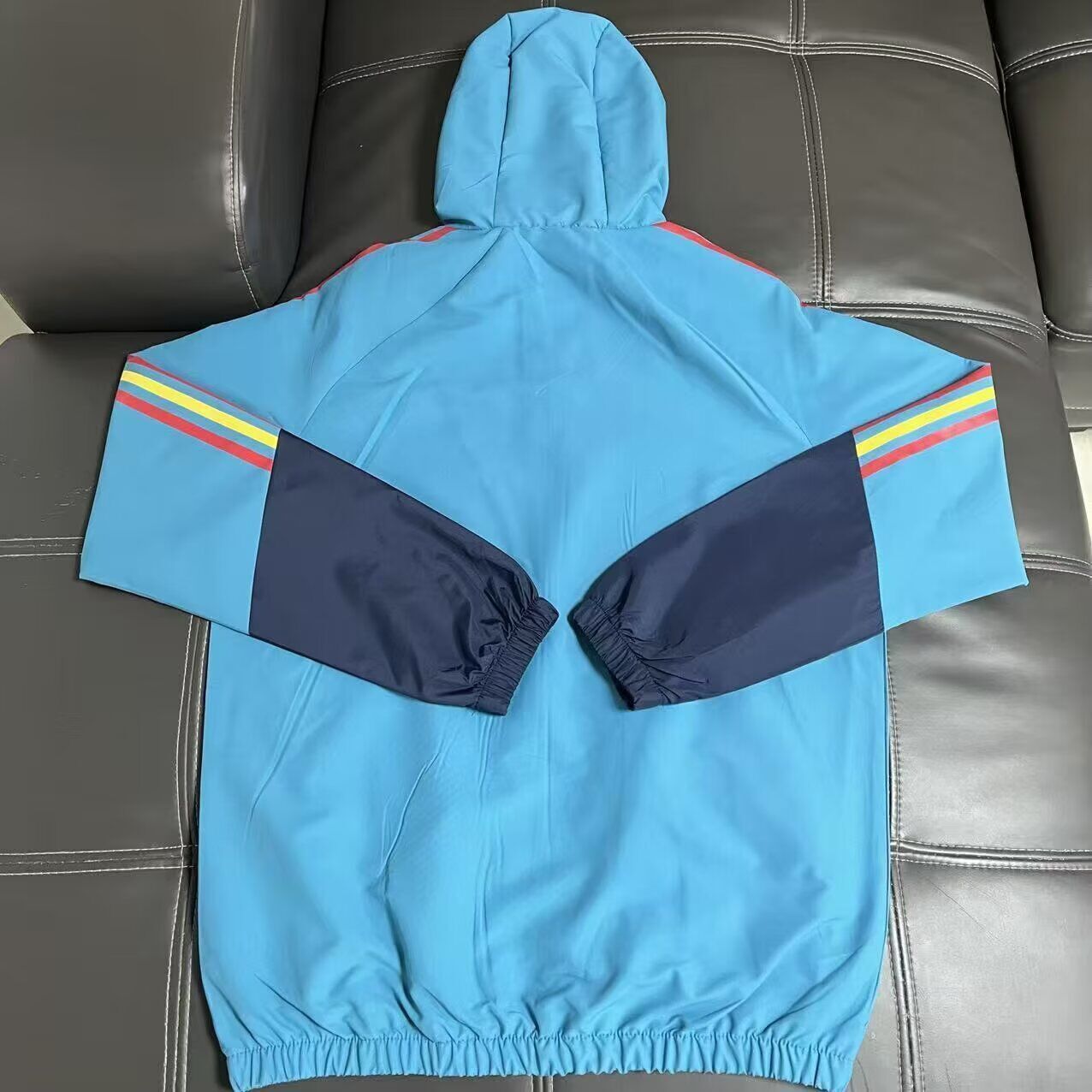 Chaqueta cortavientos con gorro España (Solo tallas S-XXL)