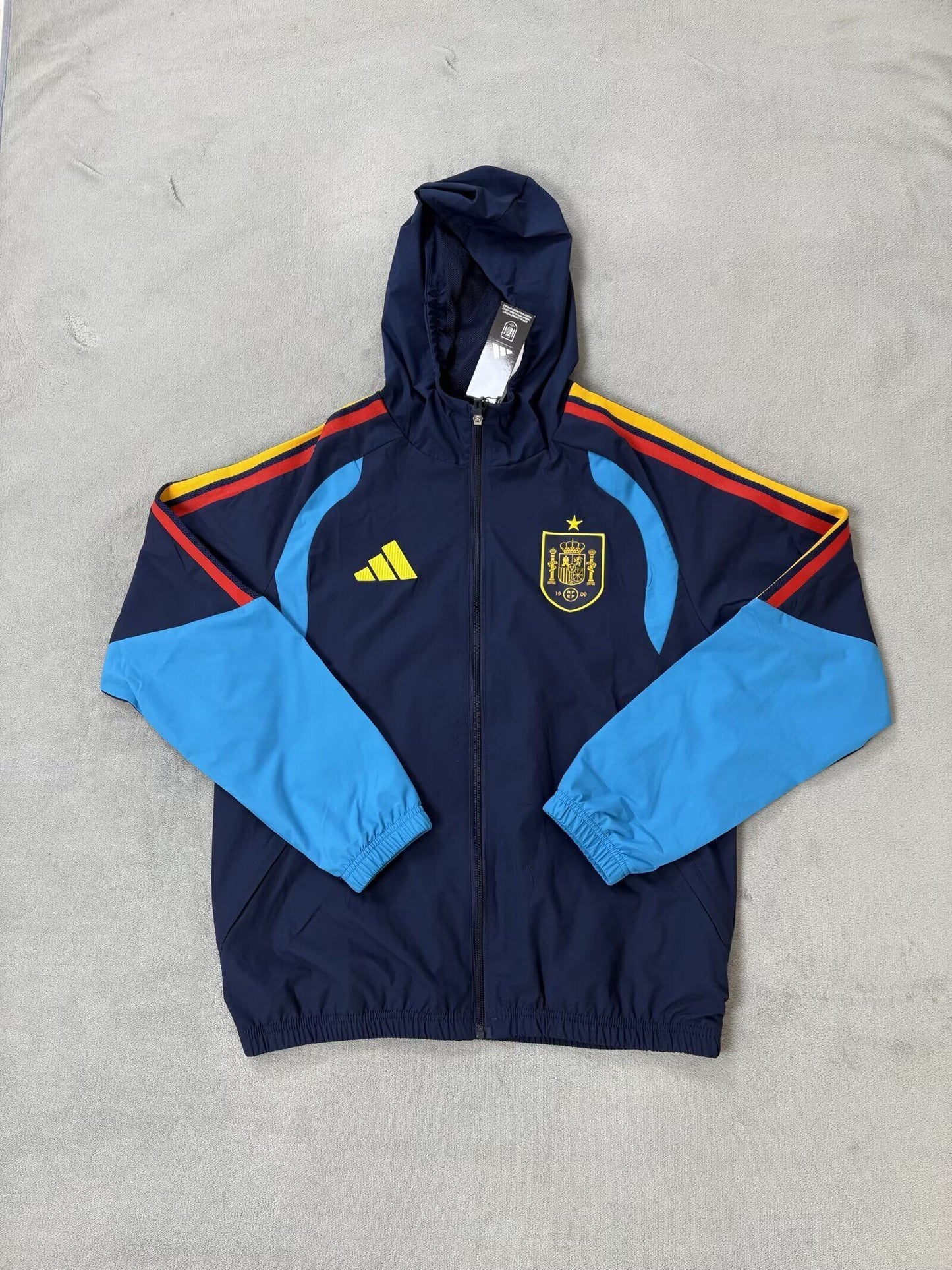 Chaqueta cortavientos con gorro España 2026 (Solo tallas S-XXL)