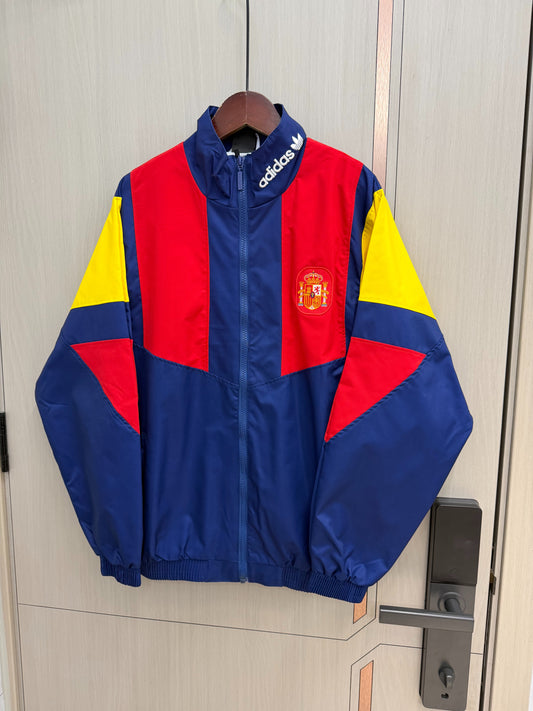 Chaqueta cortavientos España 2026 azul con rojo amarillo (tallas S-XXL)